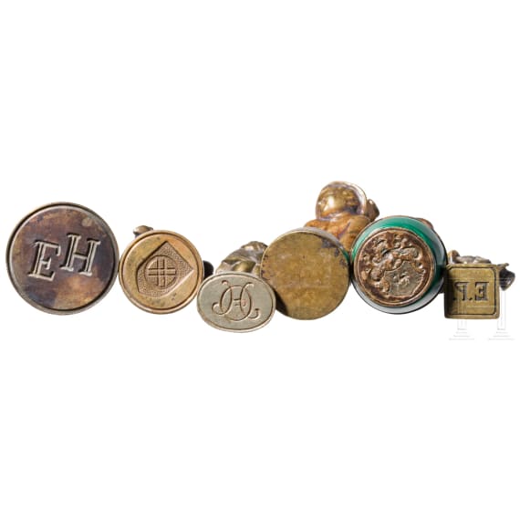 A collection of seal stamps, probably Europe, circa 1890&ndash;1930, patinated brass