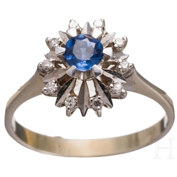 A 18ct whitegold sapphire and diammond ring