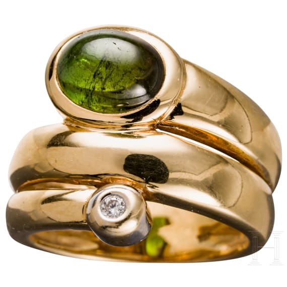 A 18ct gold snake-shaped ring with diamond and emerald