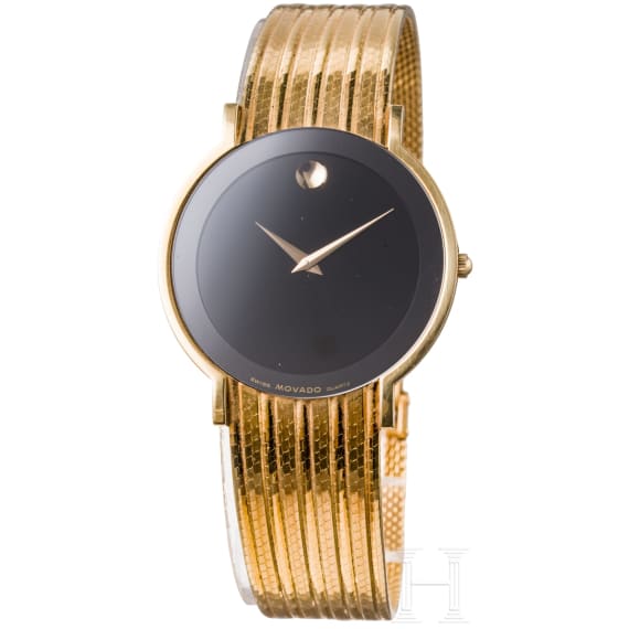 An 18-carat gold and quartz black dial Movado wristwatch with presentation box