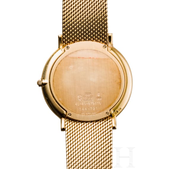 An 18-carat gold and quartz black dial Movado wristwatch with presentation box