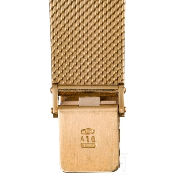 An 18-carat gold and quartz black dial Movado wristwatch with presentation box