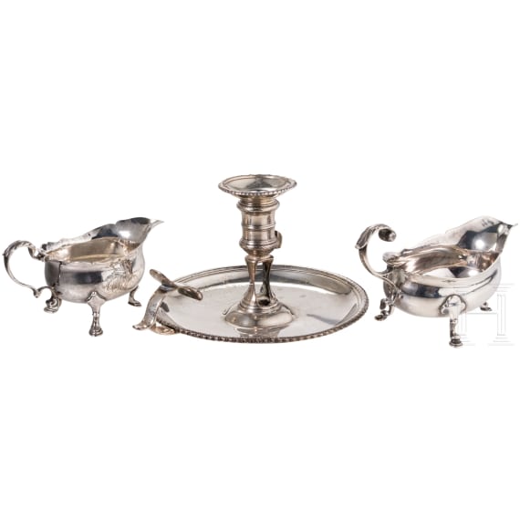An English silver hand candlestick and two sauce boats, London, 18th century