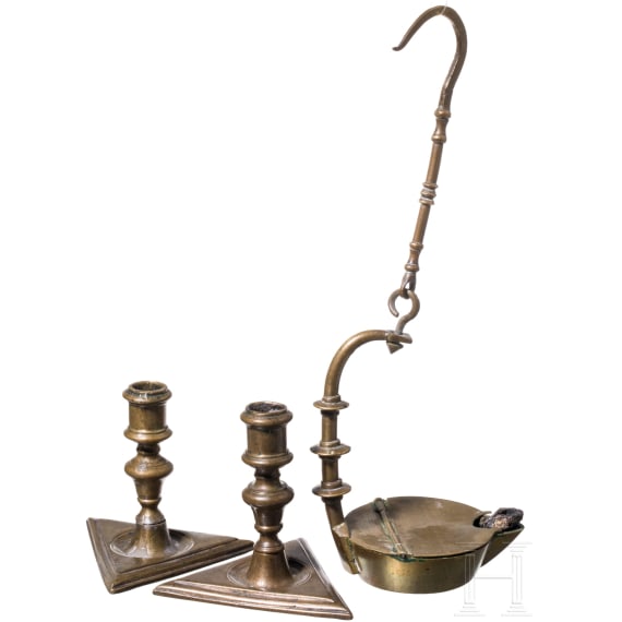Two barocque candlesticks and a miner's oil lamp, Spainish and german, 17th/18th century