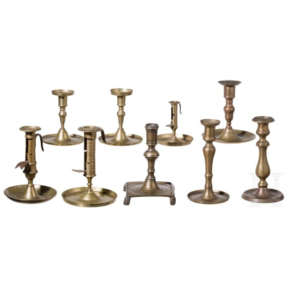 A group of nine brass candlesticks, 18th/19th century