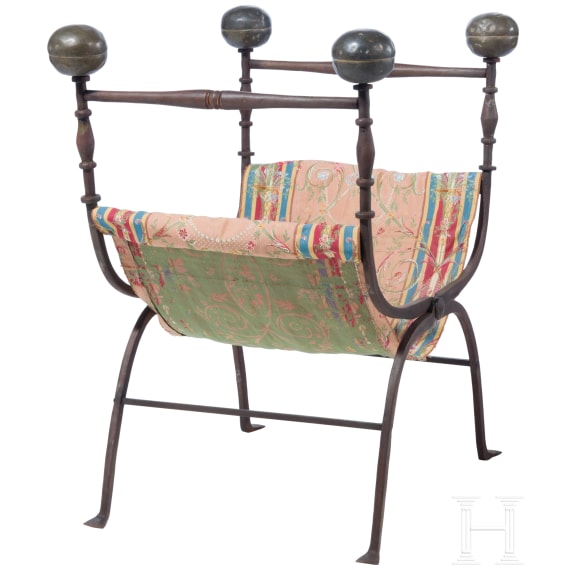 Faldstool, Italy, 17th century, in part 19th century, wrought iron, brass finials, textile seat