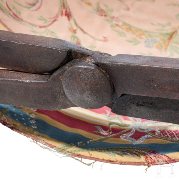 Faldstool, Italy, 17th century, in part 19th century, wrought iron, brass finials, textile seat