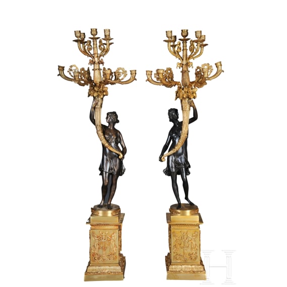 A pair of French partially gilt bronze candelabras, probably 20th century