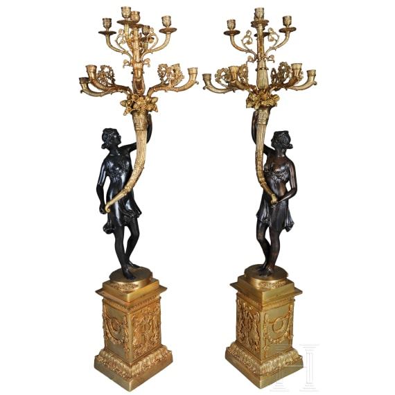 A pair of French partially gilt bronze candelabras, probably 20th century