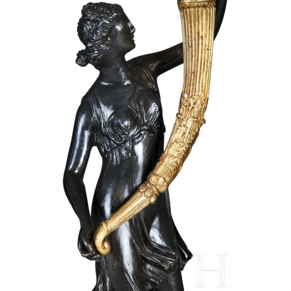 A pair of French partially gilt bronze candelabras, probably 20th century