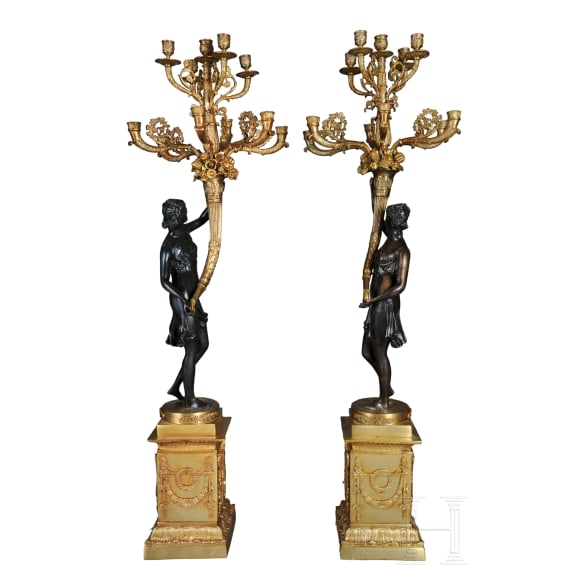 A pair of French partially gilt bronze candelabras, probably 20th century