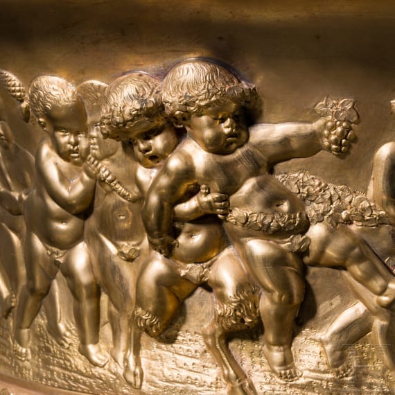 A centerpiece with putti frieze, France, probably late 19th century, cast brass with gilt-coloured finish