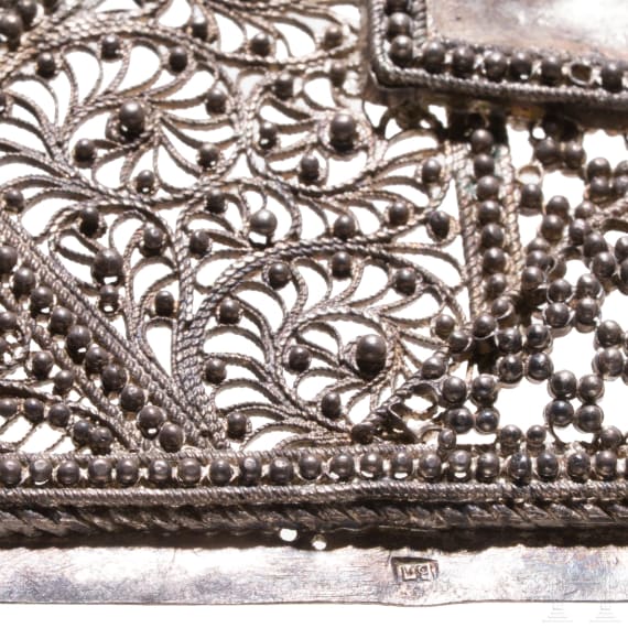 Three silver oklad fragments: Silver filigree fragment of a Saint, Silver filigree fragment of the Mother of God of the Sign and silver-gilt fragment of feast icon, Russia, 19th century
