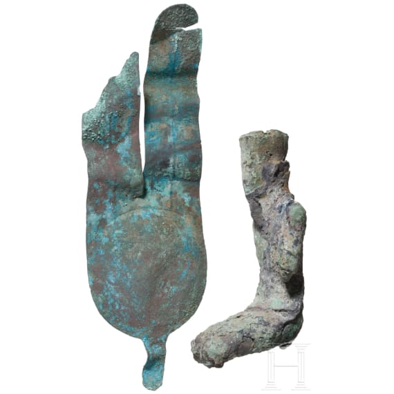 Bronze statuette of the seated god Amun and bronze insert of a crown with sun disc and double feather. Late period, middle third of the 1st millennium B.C.
