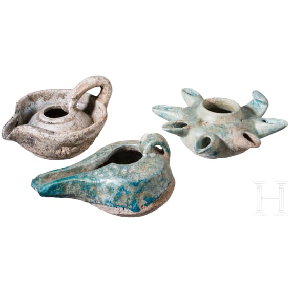 Three glazed Seljuk clay oil lamps, 12th &ndash; 13th century