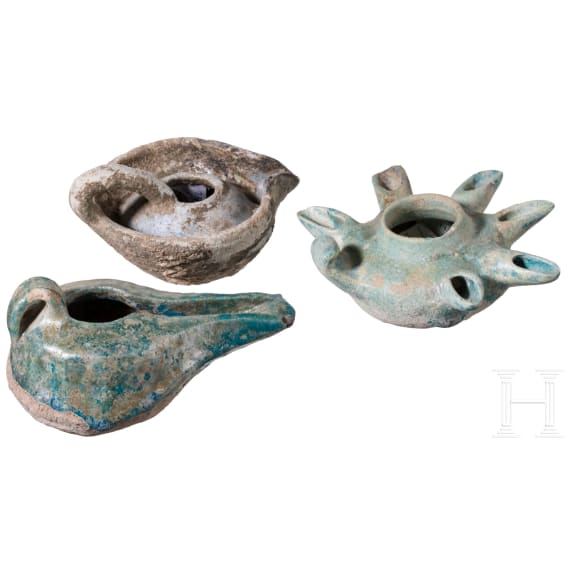 Three glazed Seljuk clay oil lamps, 12th &ndash; 13th century