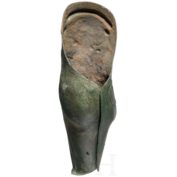 A Greek greave in bronze, anatomically formed, 5th century B.C.