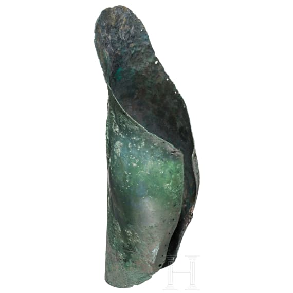 A Greek greave in bronze, anatomically formed, 5th century B.C.