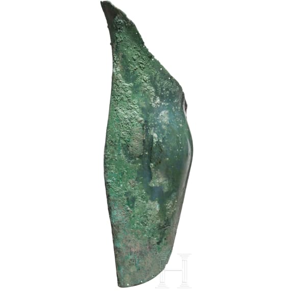 A Greek greave in bronze, anatomically formed, 5th century B.C.