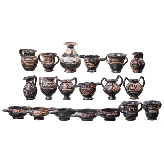 18 miniature vessels made of black glazed pottery, southern Italy, 4th &ndash; 3rd century B.C.