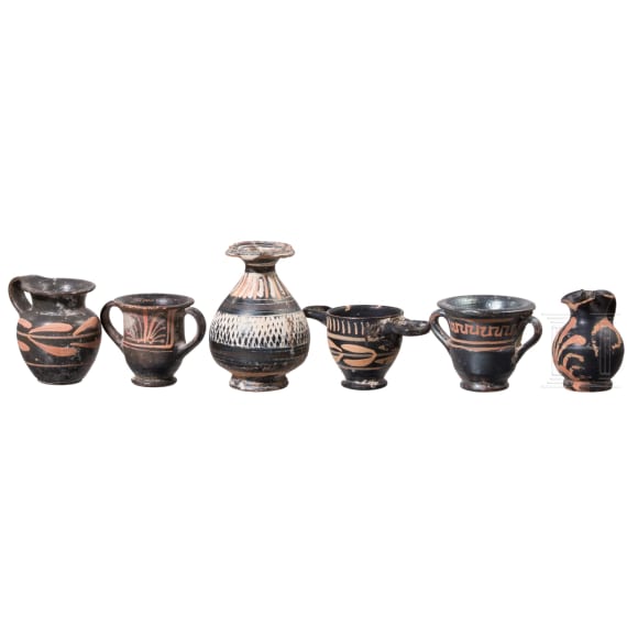 18 miniature vessels made of black glazed pottery, southern Italy, 4th &ndash; 3rd century B.C.