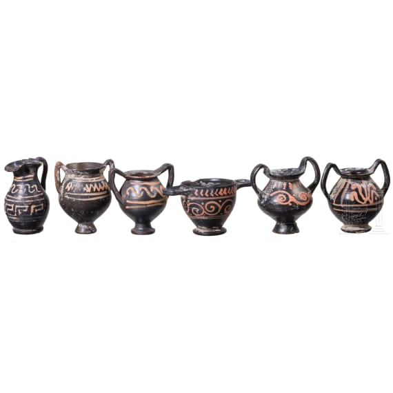 18 miniature vessels made of black glazed pottery, southern Italy, 4th &ndash; 3rd century B.C.