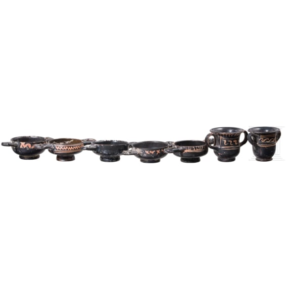 18 miniature vessels made of black glazed pottery, southern Italy, 4th &ndash; 3rd century B.C.