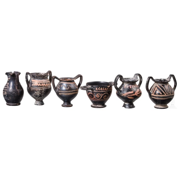 18 miniature vessels made of black glazed pottery, southern Italy, 4th &ndash; 3rd century B.C.