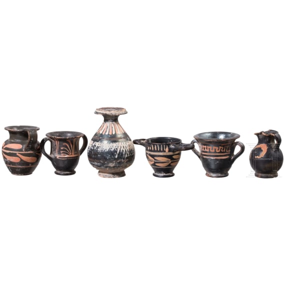 18 miniature vessels made of black glazed pottery, southern Italy, 4th &ndash; 3rd century B.C.