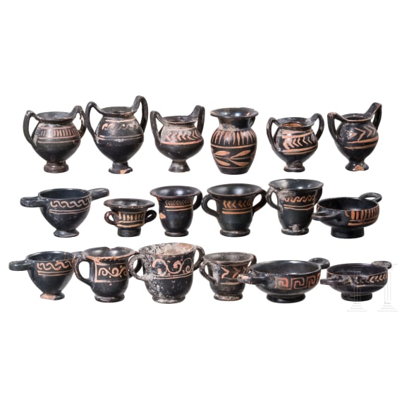 18 miniature vessels made of black glazed pottery, southern Italy, 4th &ndash; 3rd century B.C.