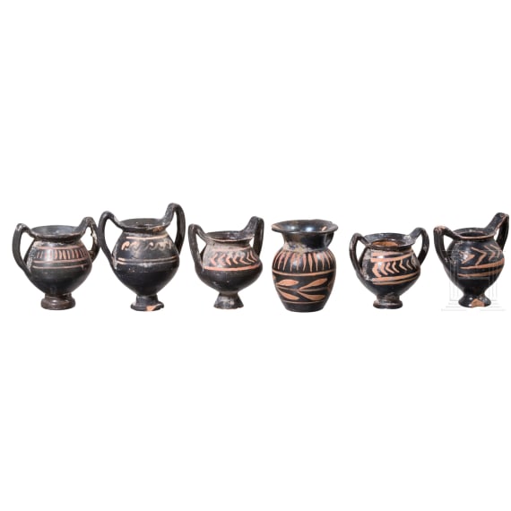18 miniature vessels made of black glazed pottery, southern Italy, 4th &ndash; 3rd century B.C.