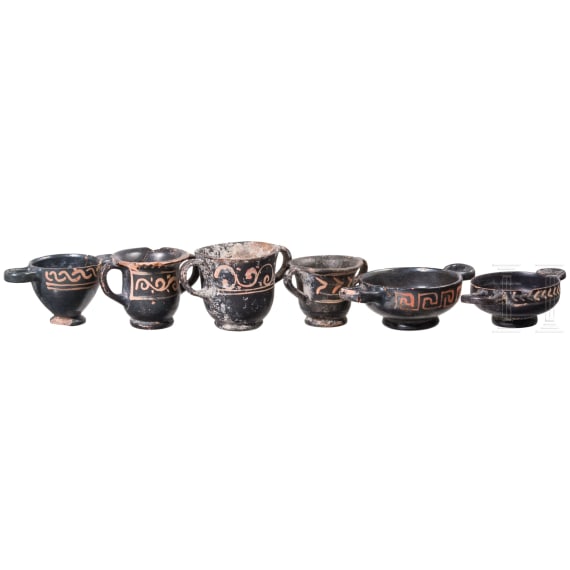 18 miniature vessels made of black glazed pottery, southern Italy, 4th &ndash; 3rd century B.C.