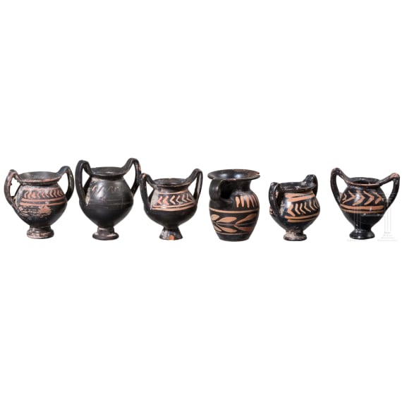 18 miniature vessels made of black glazed pottery, southern Italy, 4th &ndash; 3rd century B.C.