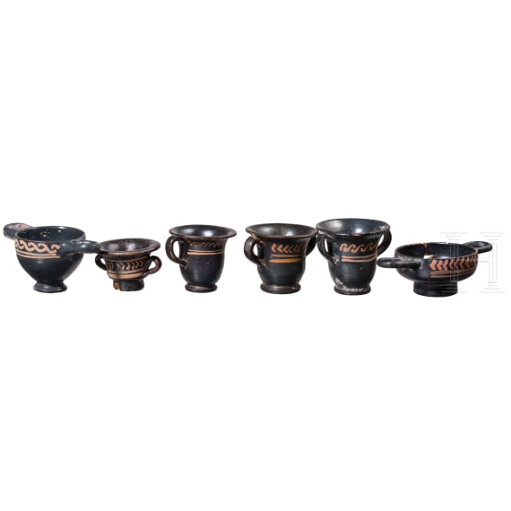 18 miniature vessels made of black glazed pottery, southern Italy, 4th &ndash; 3rd century B.C.
