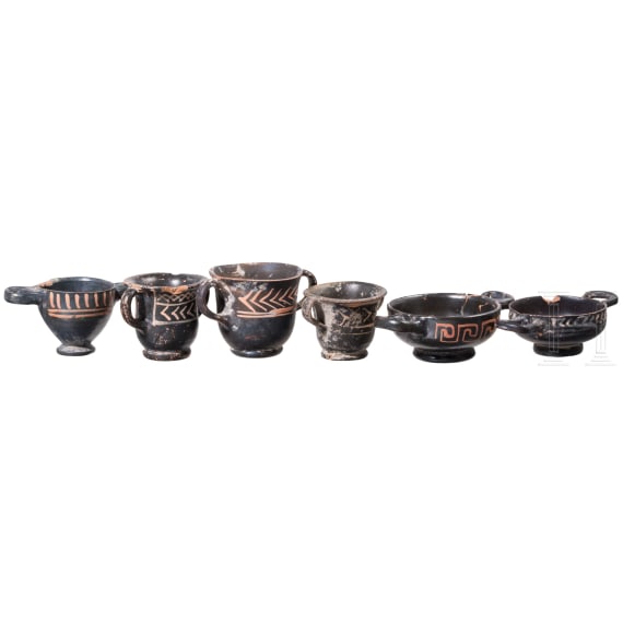 18 miniature vessels made of black glazed pottery, southern Italy, 4th &ndash; 3rd century B.C.