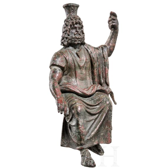 An enthroned Roman bronze statuette of Serapis, 2nd - 3rd century