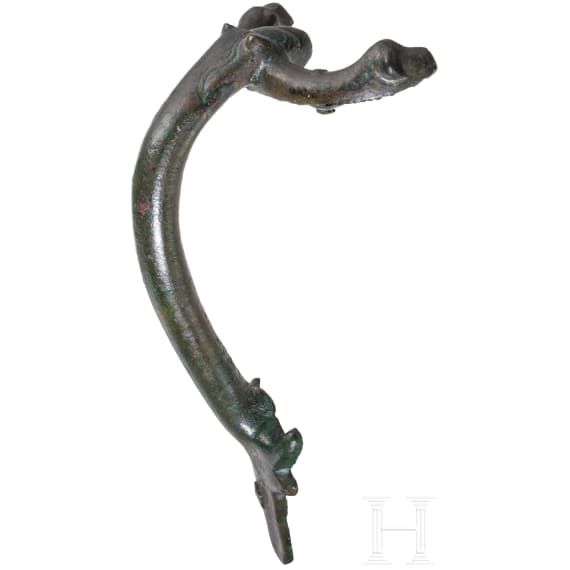 A Roman bronze handle attachment of a jug, 2nd - 3rd century