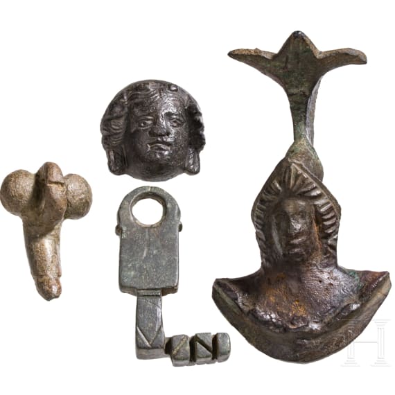 Two provincial Roman appliqu&eacute;s, a phallic pendant, and a key, 2nd to 3rd century