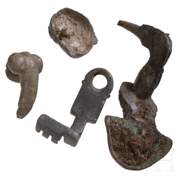 Two provincial Roman appliqu&eacute;s, a phallic pendant, and a key, 2nd to 3rd century
