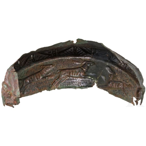 Frontal plate made of bronze sheet from a Roman helmet with an inscription, along with four fragments of an armour clasp, Roman, 2nd &ndash; early 3rd century A.D.