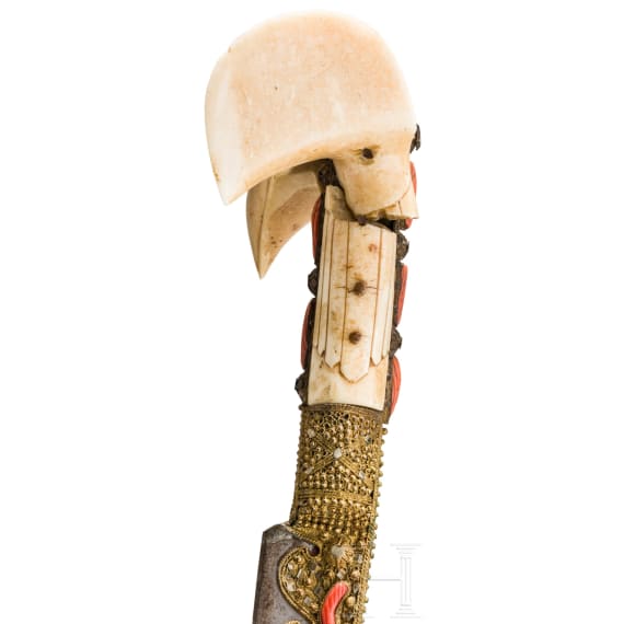 An Ottoman silver-mounted yatagan, set with corals, circa 1840