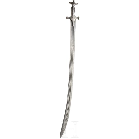 An Indian Tulwar with silver damscened hit and damascus blade, ca. 1800