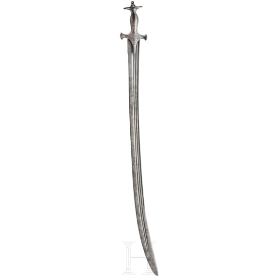 An Indian Tulwar with silver damscened hit and damascus blade, ca. 1800