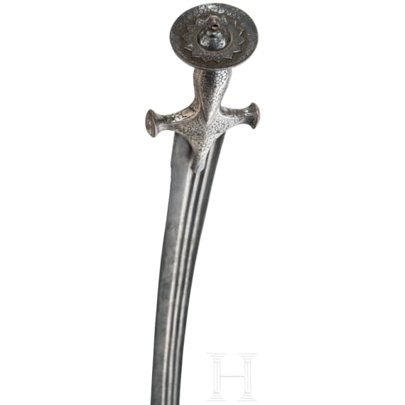 An Indian Tulwar with silver damscened hit and damascus blade, ca. 1800