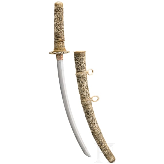 A carved ivory-mounted Wakizashi, late Edo period