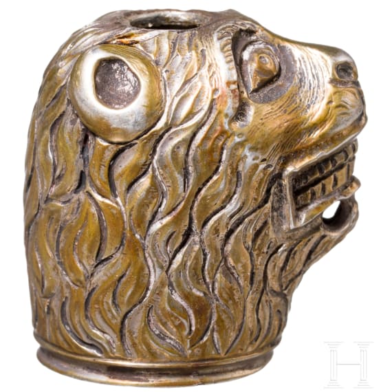 A German lion's head pommel made of gild silver, 2nd half of the 17th century