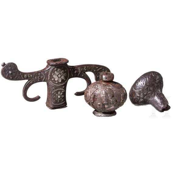 Two German/Italian iron pommels and a guard, 17th/18th century