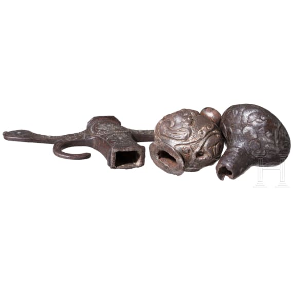 Two German/Italian iron pommels and a guard, 17th/18th century