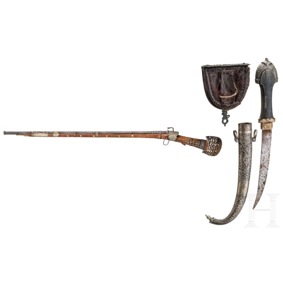 A yemenite matchlock rifle with cartridge pouch and Khoumya, 19th and 20th century