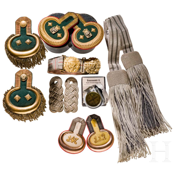 A small collection of German insignias and a compass